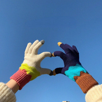 Knitting patchwork touchscreen gloves in autumn outdoor setting