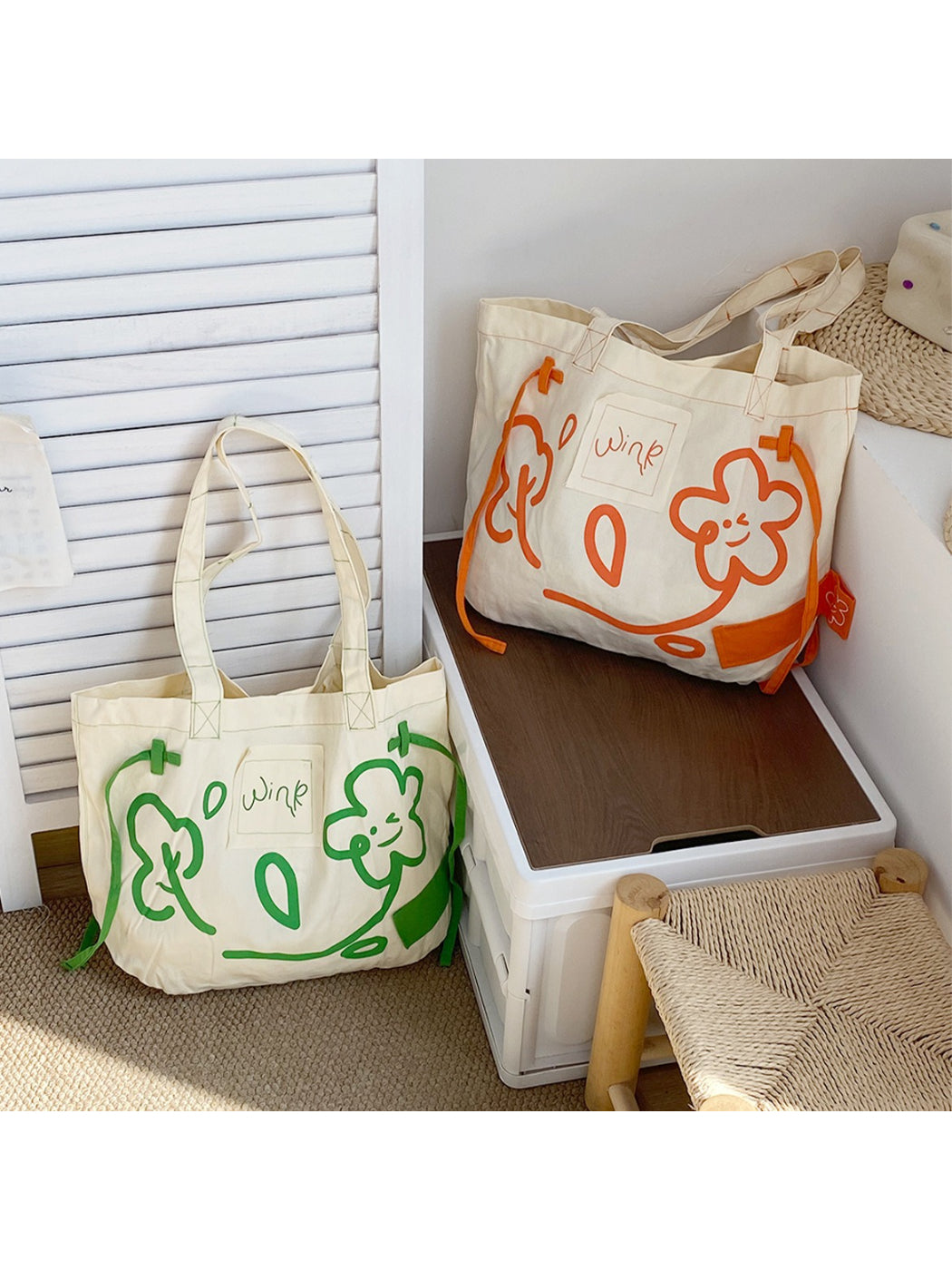Close-up of Cosbai tote bag showing black handles and detailed graphic print