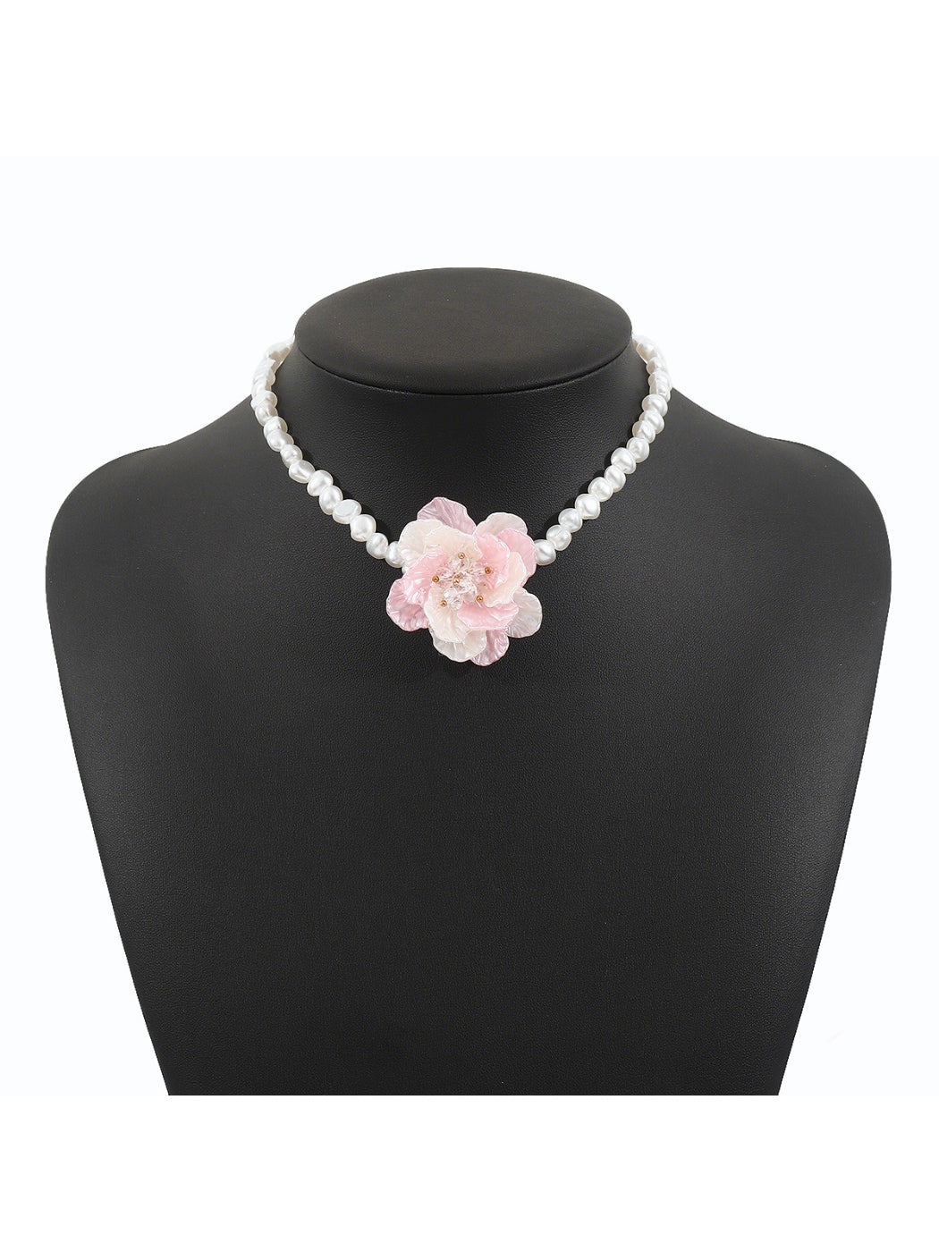 Model wearing white beaded flower necklace paired with a light-colored top