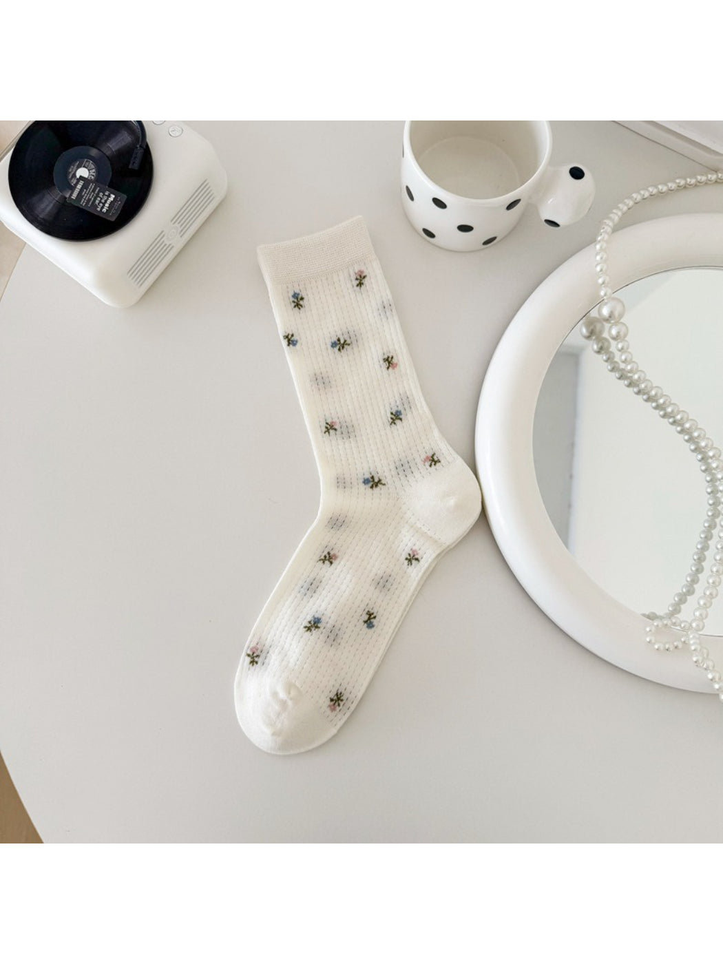 Rufia soft blossom crew socks paired with casual shoes on wooden floor