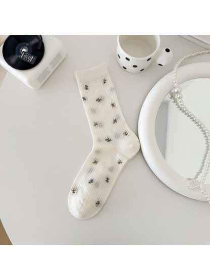 Rufia soft blossom crew socks paired with casual shoes on wooden floor