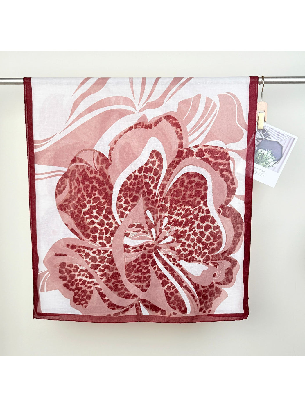 Scarvii scarf draped over shoulders highlighting vibrant leopard and flower print