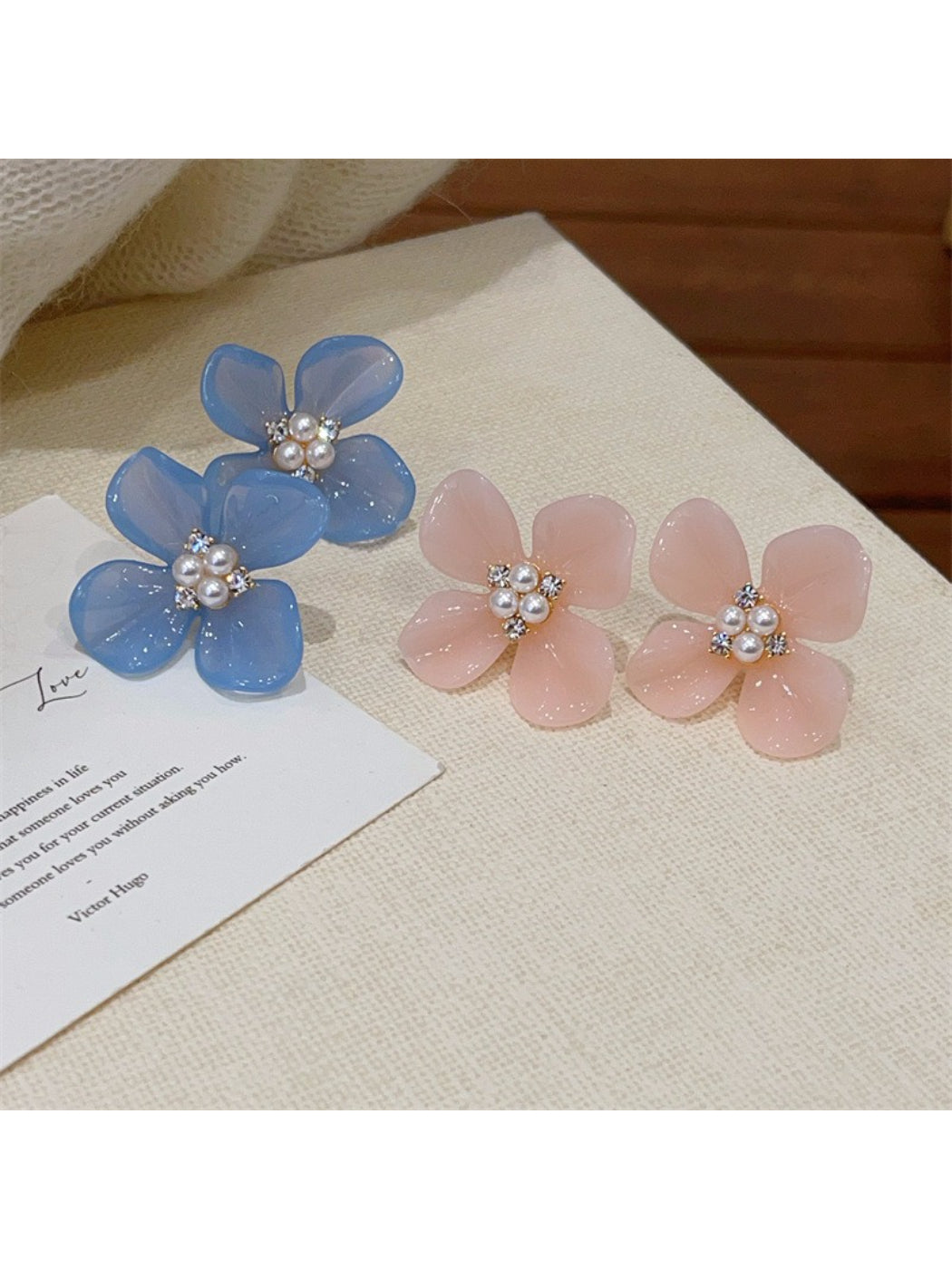 Close-up of Earwish Rounded Petal Bloom Earrings in gold finish on white background