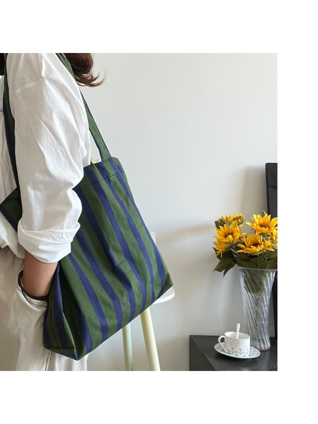 Close-up of green and white striped fabric texture on Cosbai shoulder tote bag