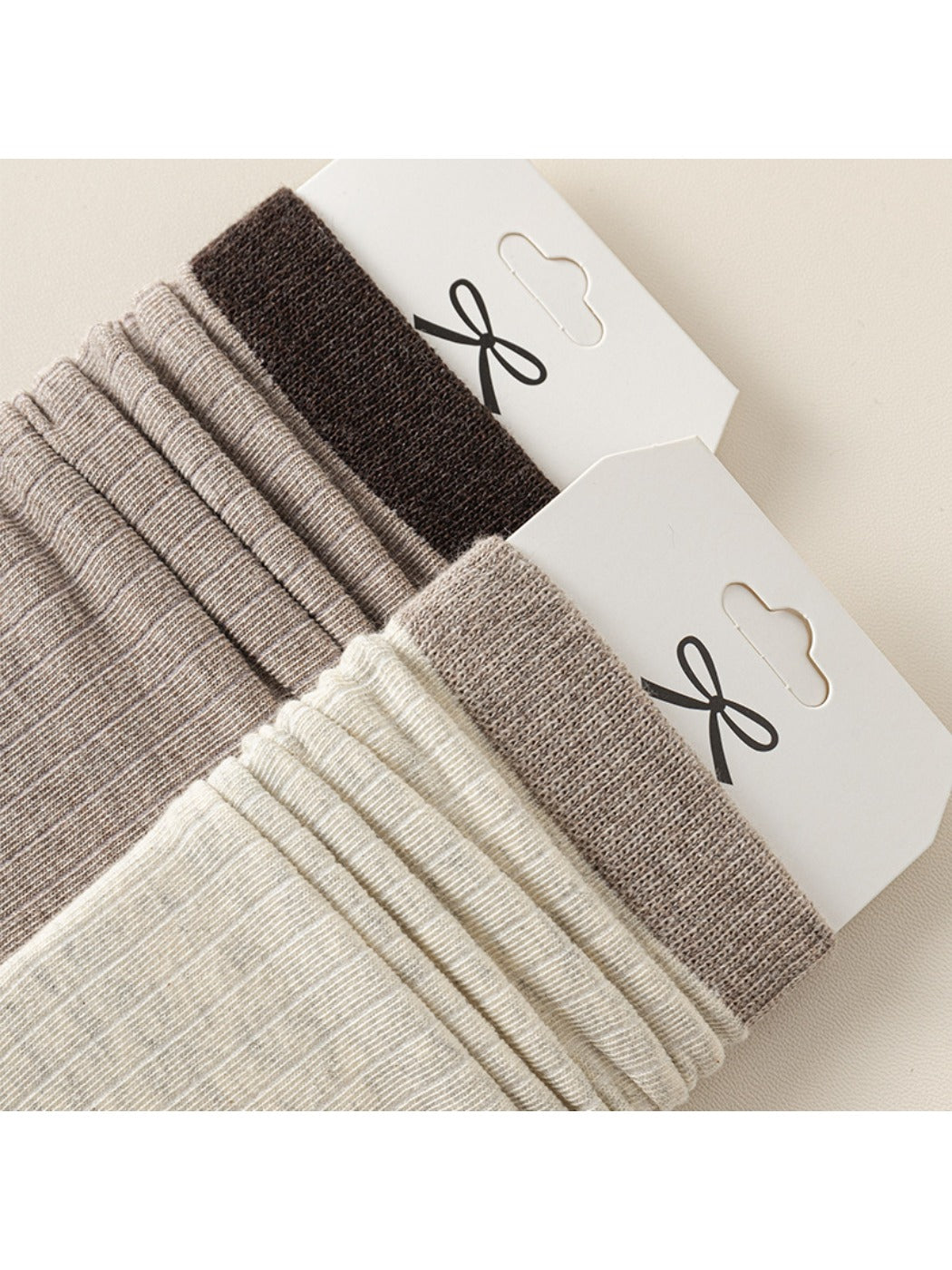 Rufia ribbed mid-calf socks for women in light gray shown folded
