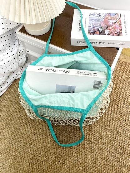 Cosbai tote bag with handles resting on a wooden bench