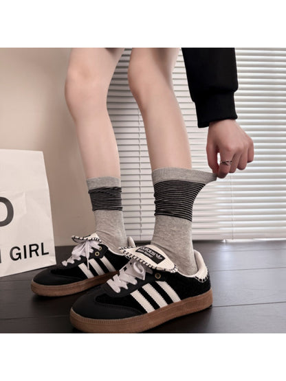 Rufia ribbed stripe mid-calf socks worn on feet showing fit and stripe design