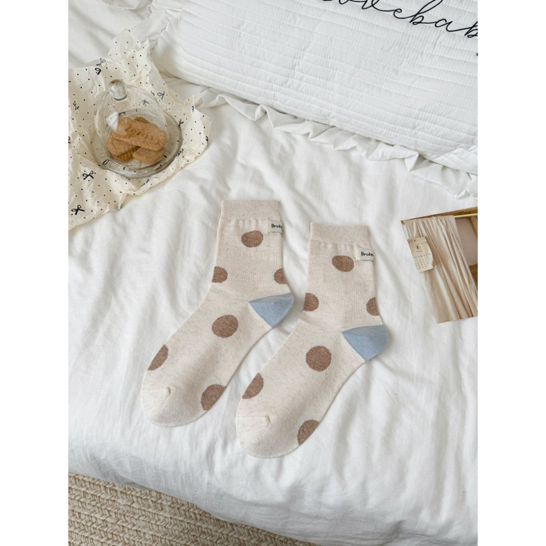 Rufia contrast heel dot pattern socks arranged to show front and side views