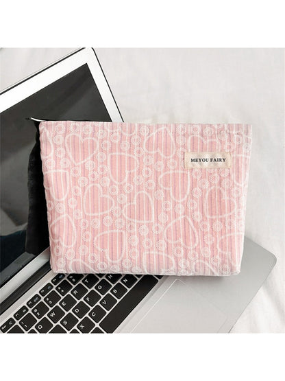 Cosbai heart pattern cosmetic bag standing upright on a flat surface
