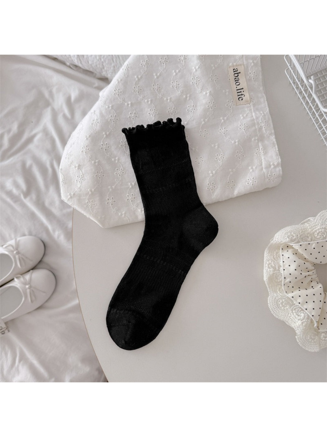 Rufia soft ruffle pointelle crew socks worn on feet showing texture and fit