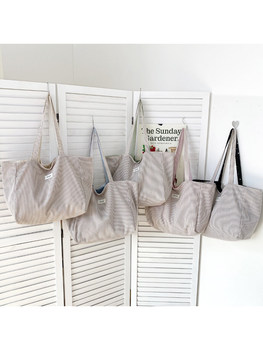 Side view of Cosbai Star Print Soft Shoulder Tote highlighting strap and bag shape