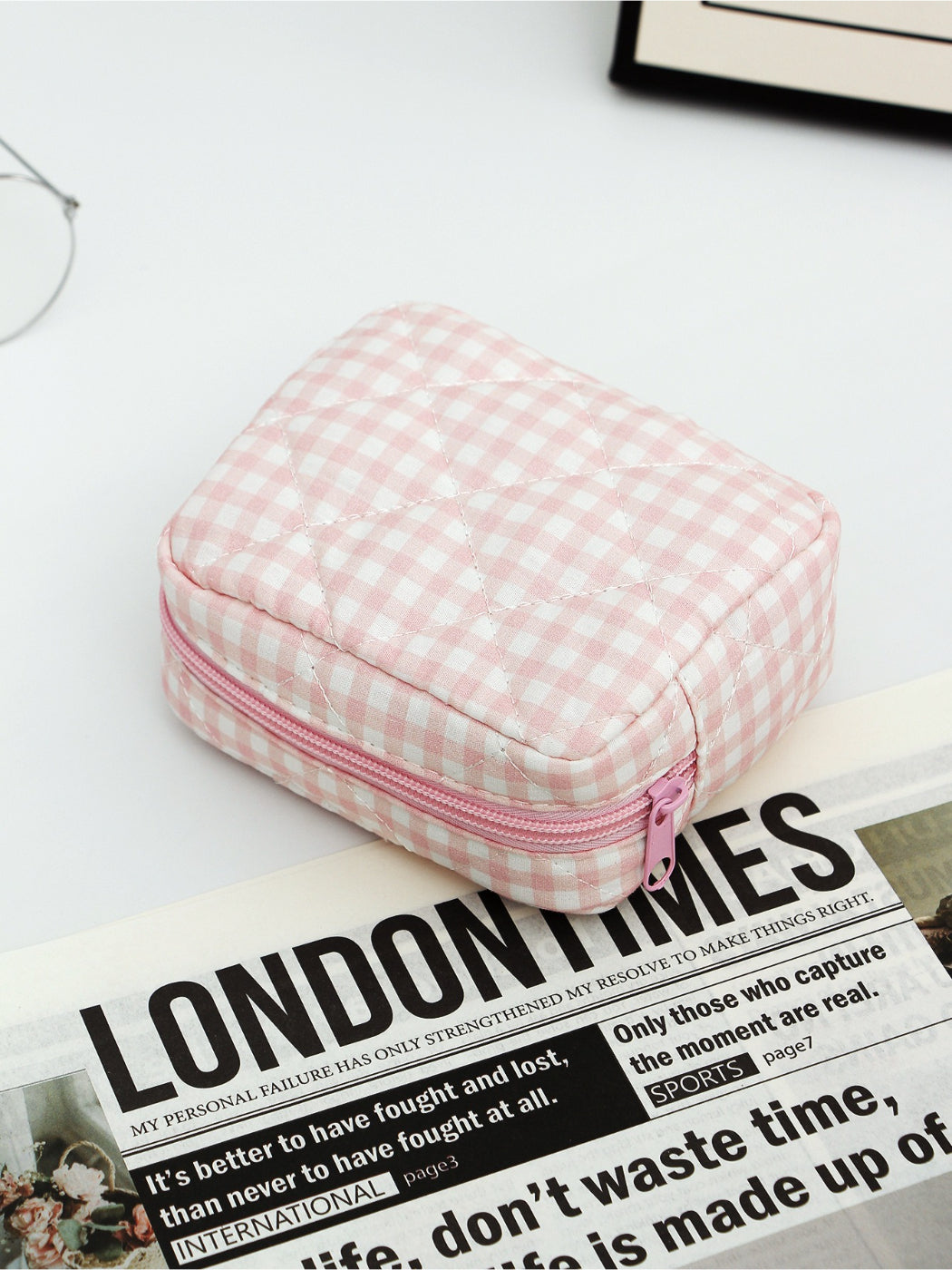 Cosbai checkered makeup pouch trio with ruffle trim stacked on top of each other