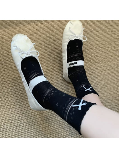 Soft blue ribbon socks styled with a light outfit in natural light
