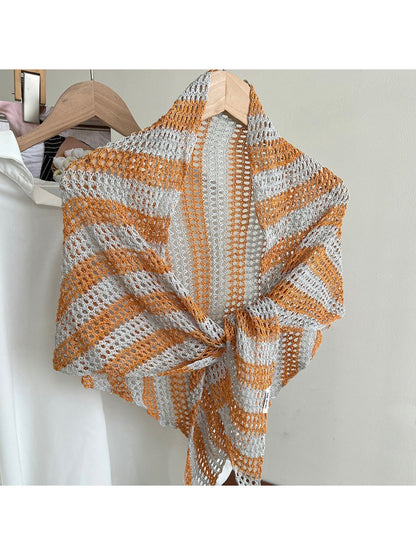 Scarvii open knit scarf draped over chair showcasing triangle shape
