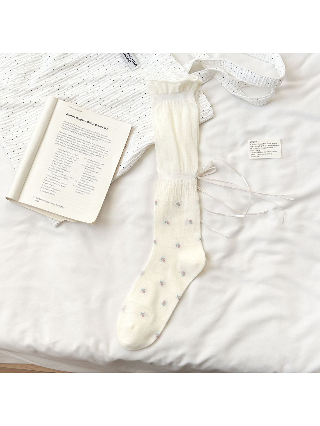 Close-up of Rufia Soft Bloom Ruffle Crew Socks showing delicate floral design and soft fabric texture