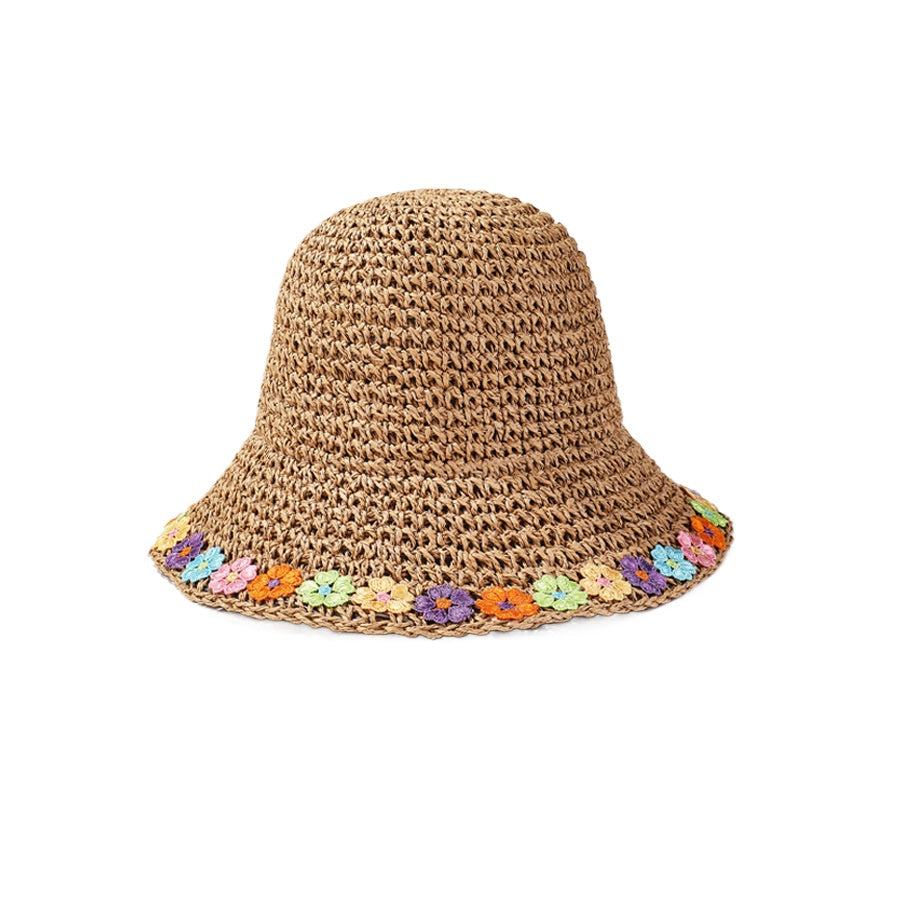 Haila sun hat folded to show flexible brim with rainbow daisy edge pattern