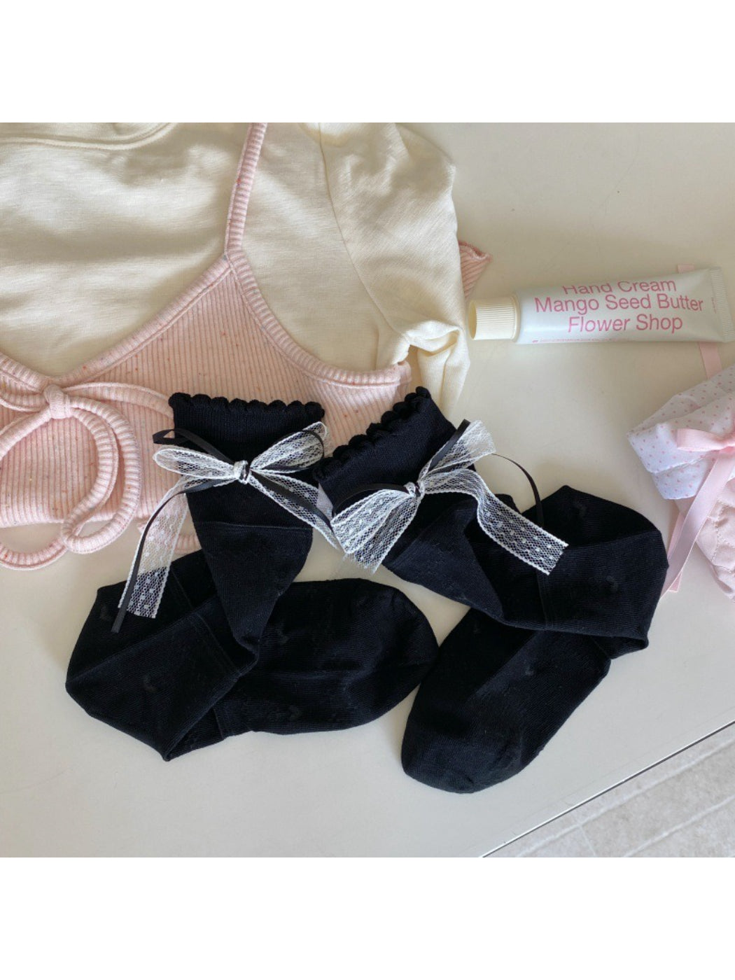 Rufia Romantic Ribbon Trim Socks folded to display ribbon and sock length