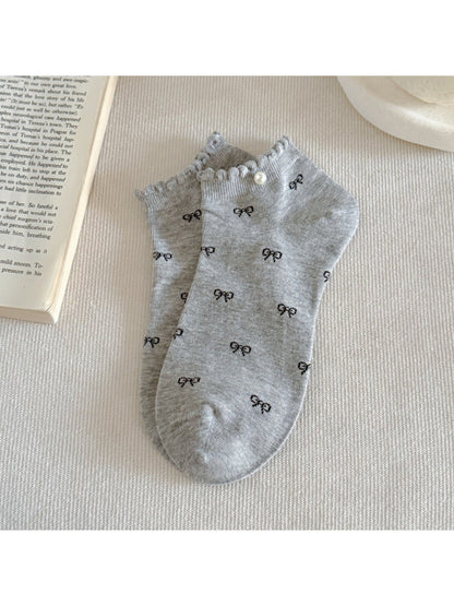 Rufia ankle socks styled with outfit, featuring pink bows and frill trim