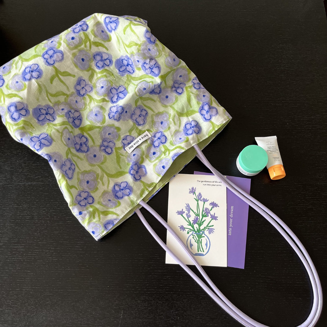 Top view of Cosbai purple bucket bag showing drawstring closure and strap