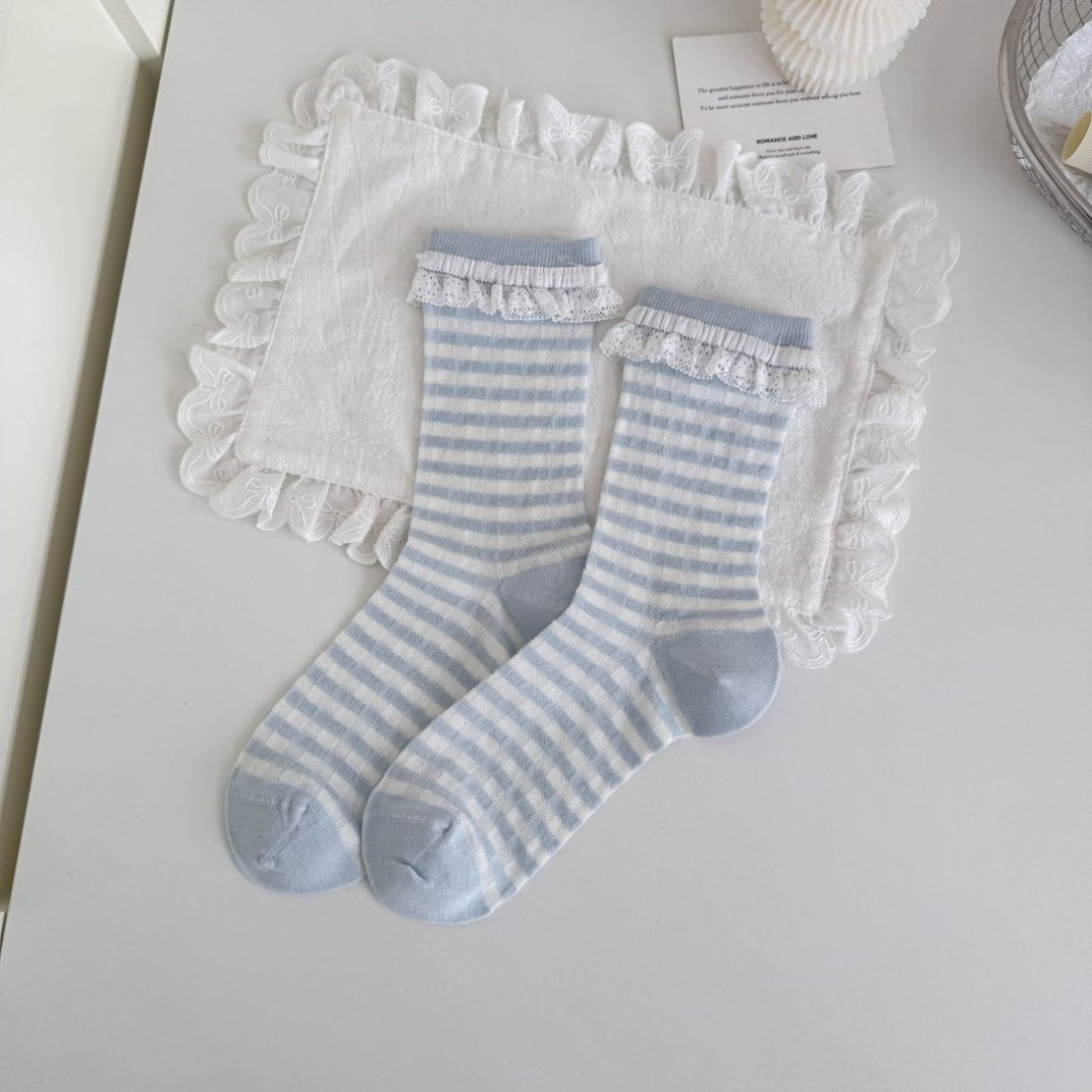 Rufia blue tone crew socks folded neatly on a white background