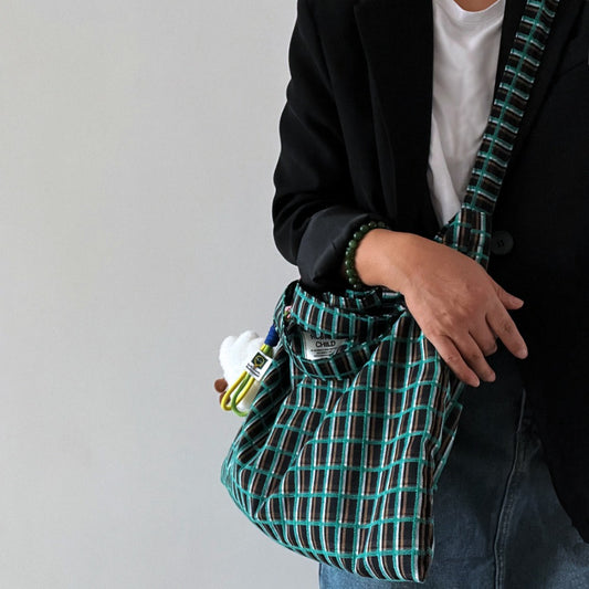 Close-up of the checked fabric texture on Cosbai slouchy shoulder tote bag