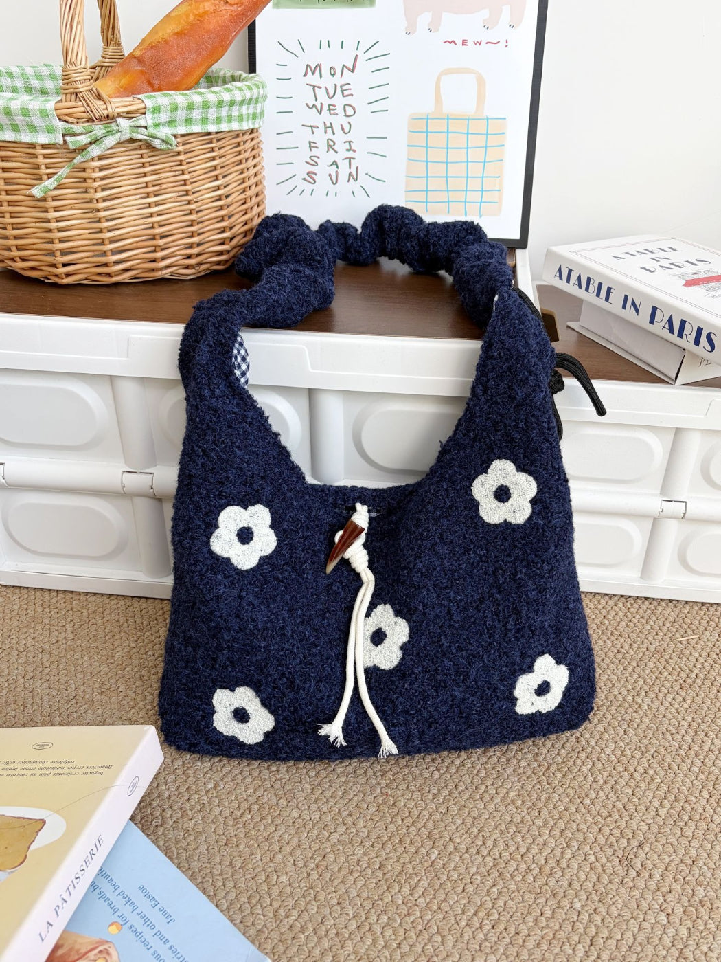 Close-up of knit texture and colorful floral embroidery on Cosbai shoulder bag