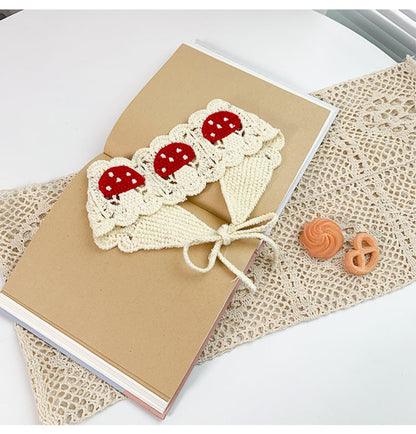 Haila crochet mushroom hairband laid flat with visible crochet stitches and mushroom motif