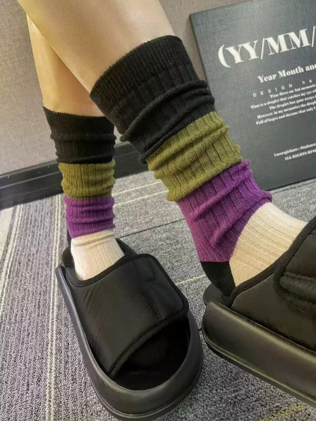 Side view of Rufia colorblock ribbed crew socks highlighting the blue, yellow, and white sections