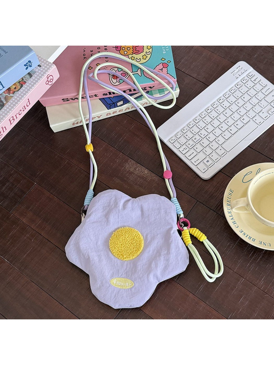 Side view of Cosbai floral mini crossbody coin pouch highlighting thickness and stitching