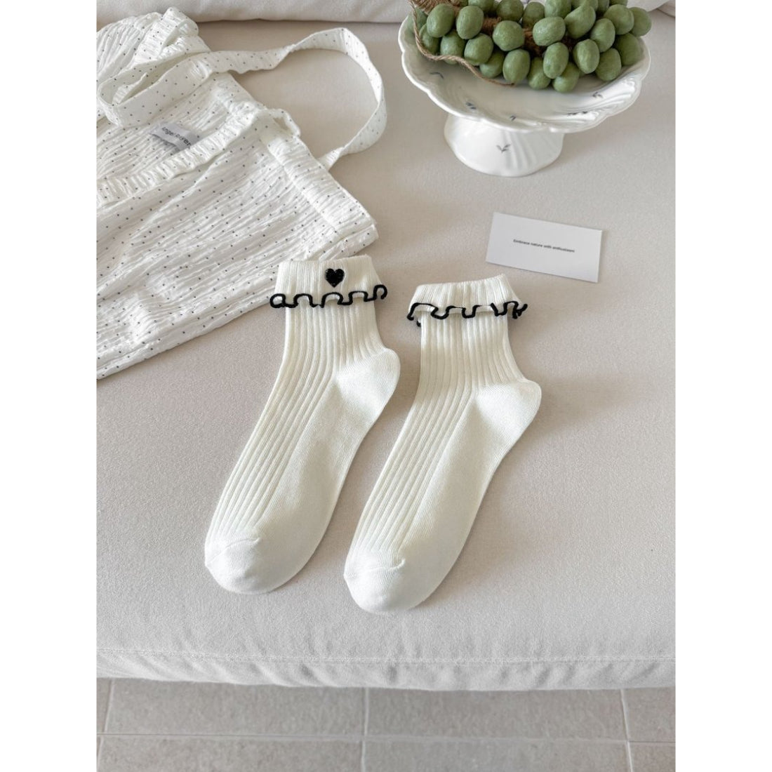 Rufia soft lettuce cuff socks worn with sneakers, highlighting cuff ruffles