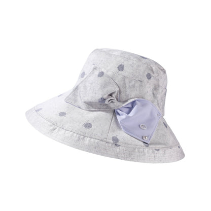 Haila polka dot bow brim hat hanging on a hook against plain wall