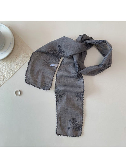 Scarvii narrow scarf styled with casual outfit highlighting floral stitch design