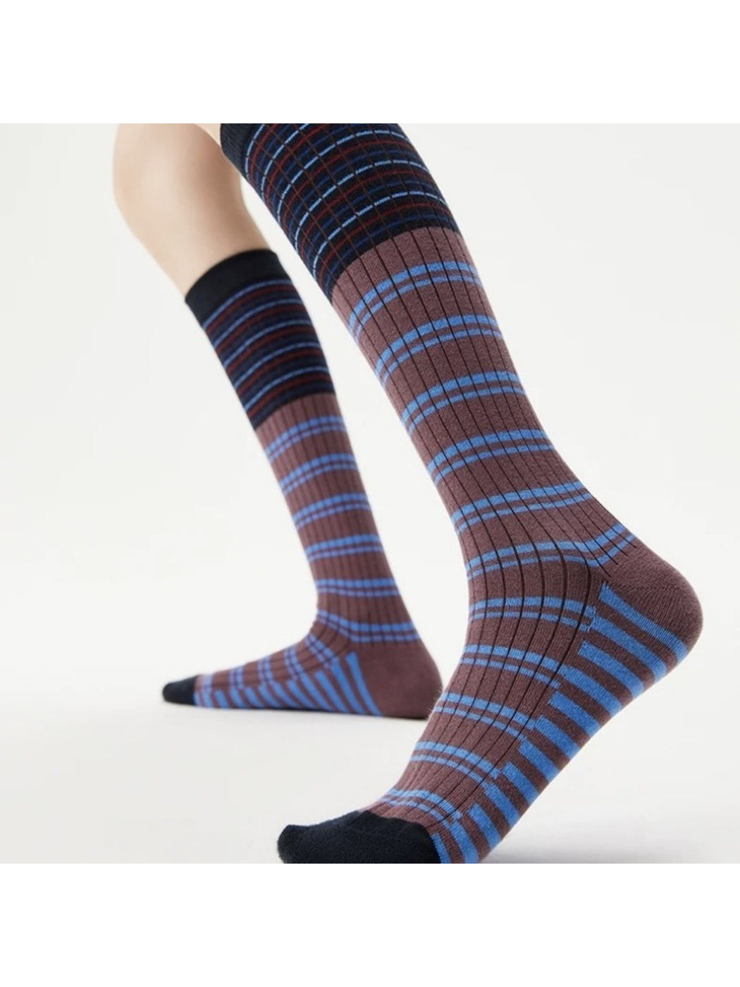 Rufia socks worn with casual sneakers highlighting the contrast stripes