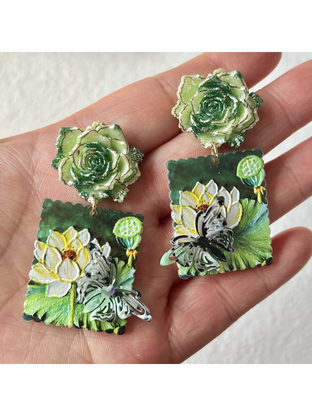 Model wearing Earwish Lotus Garden drop earrings showcasing their length and floral design