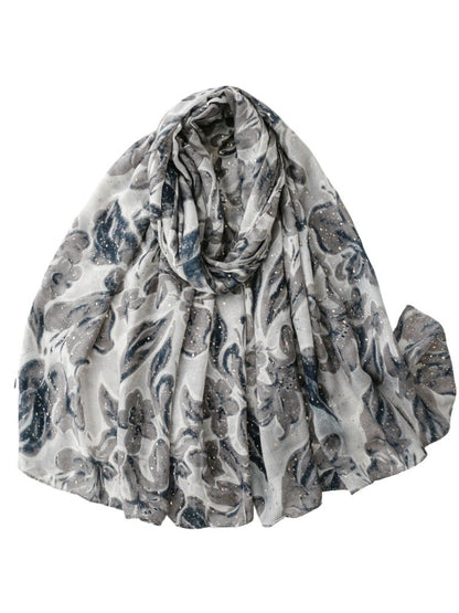 Model wearing Scarvii floral lightweight scarf styled around the neck with casual outfit