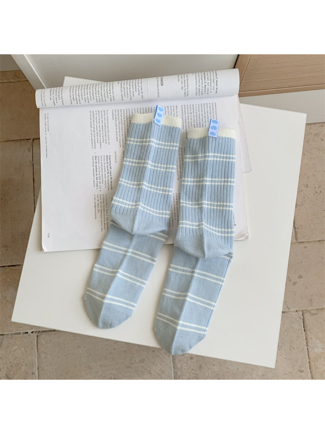 Multiple pairs of Rufia soft crew socks stacked showing various contrast stripe colors