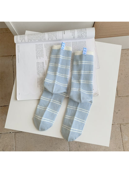 Multiple pairs of Rufia soft crew socks stacked showing various contrast stripe colors