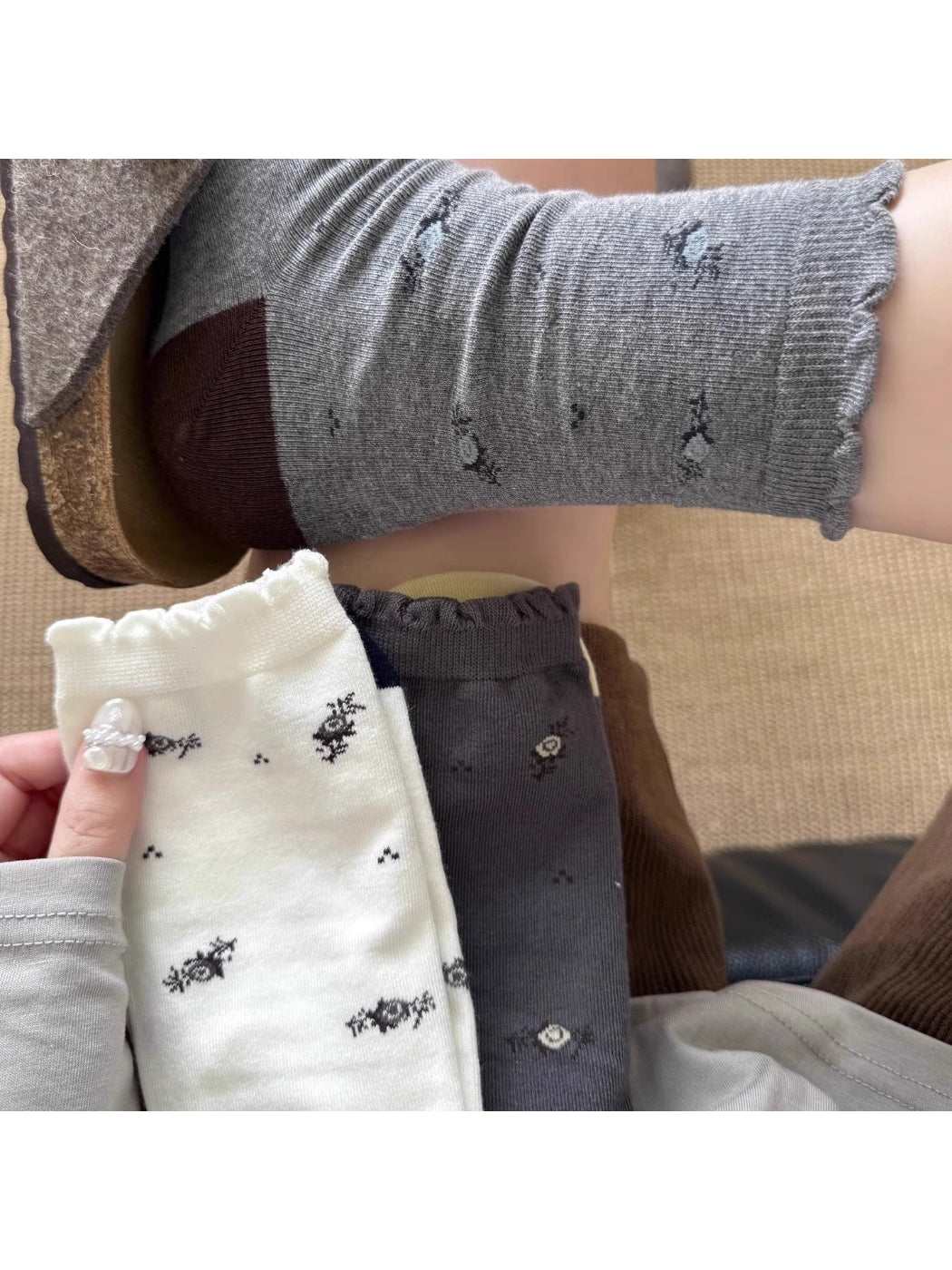 Close-up of floral knit pattern on Rufia Classic Crew Socks showing detailed stitching