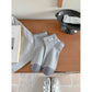 Rufia ankle socks paired with rolled-up jeans showing black toe detail