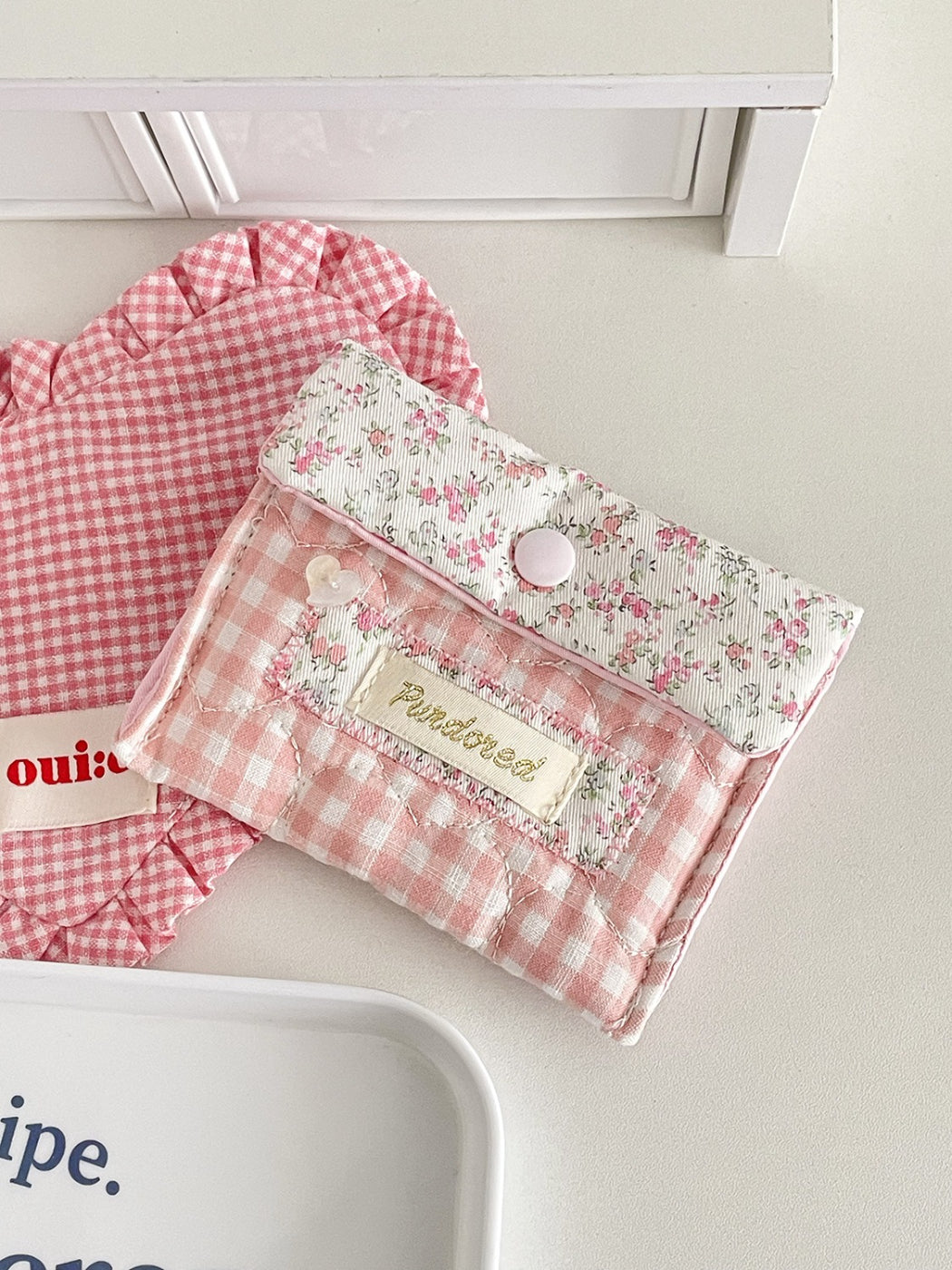 Side view of Cosbai Floral Gingham Snap Button Pouch highlighting thickness and stitching