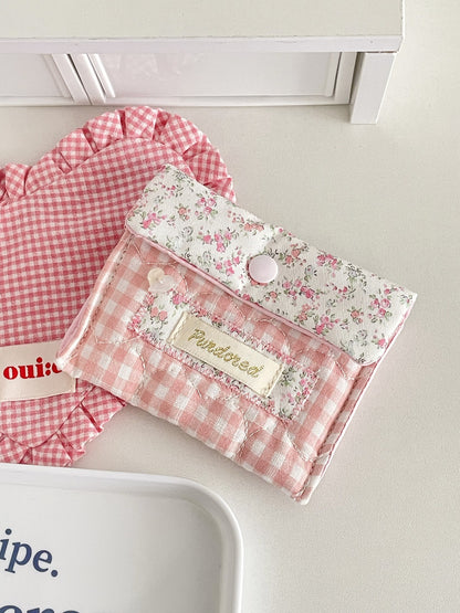 Side view of Cosbai Floral Gingham Snap Button Pouch highlighting thickness and stitching