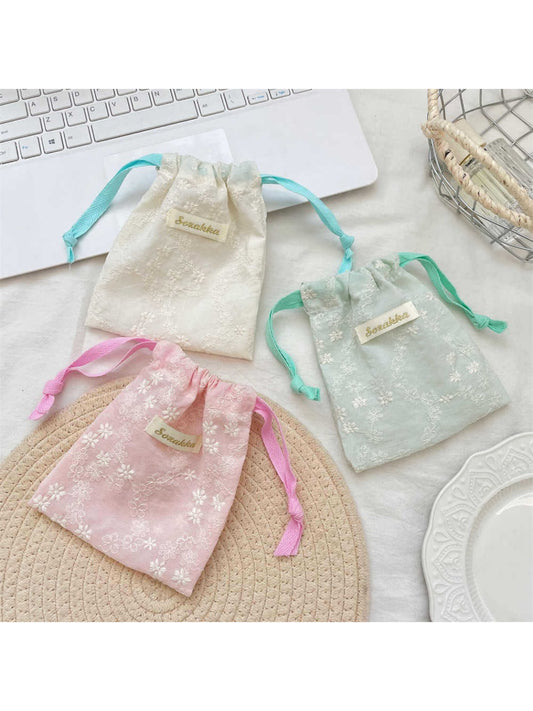 Cosbai floral lace drawstring pouch with intricate lace pattern on a white background