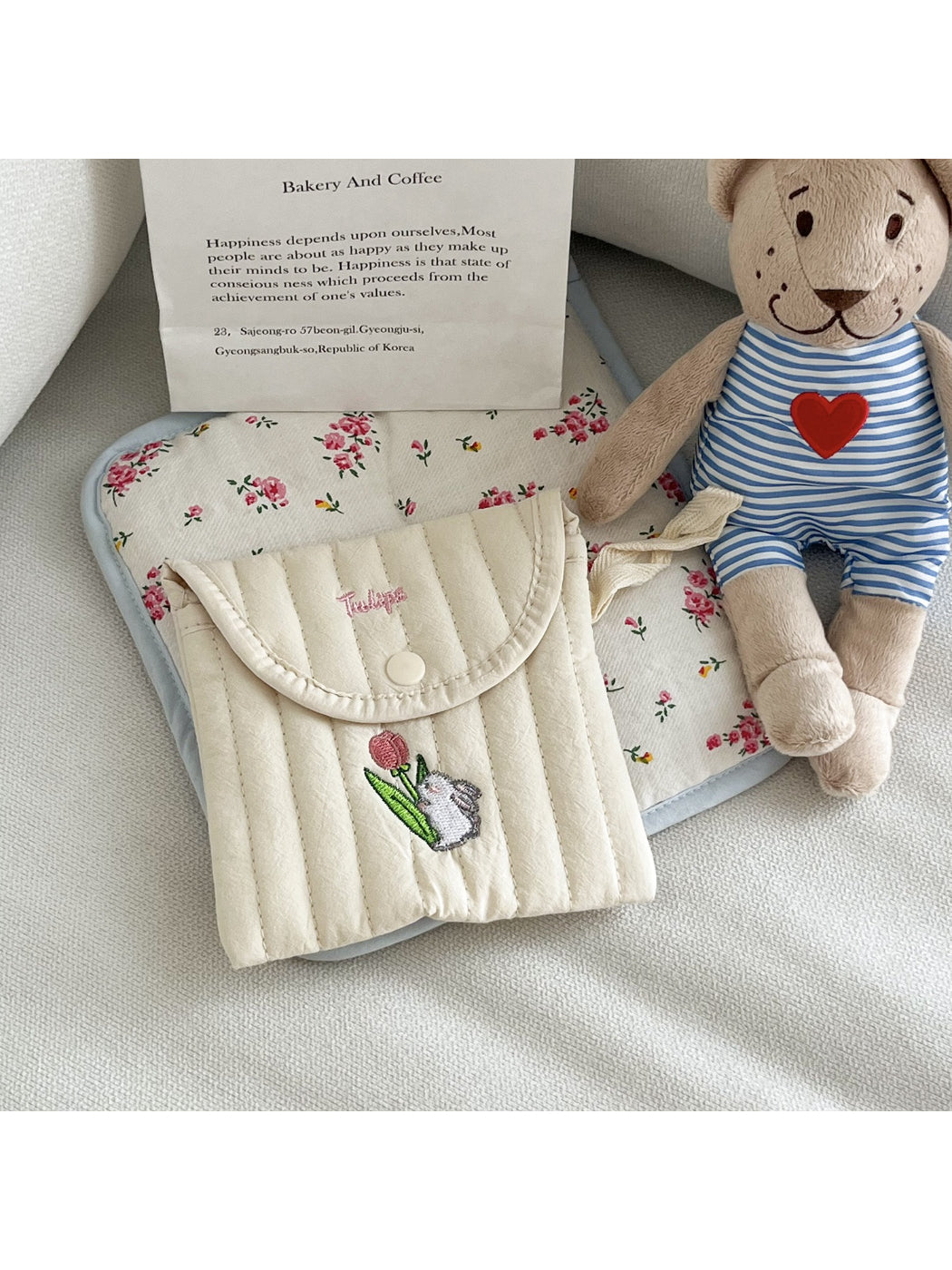 Cosbai animal stitch pouch held in hand to show size and portability