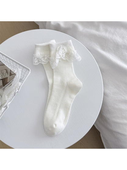 Rufia socks folded to show soft fabric and lace edging