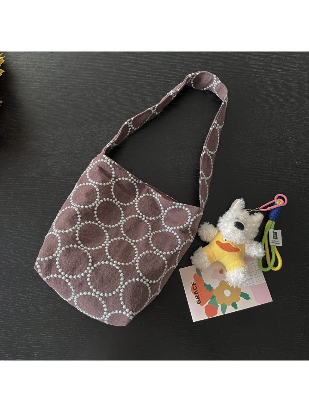 Model carrying Cosbai soft textured slouch tote bag over shoulder