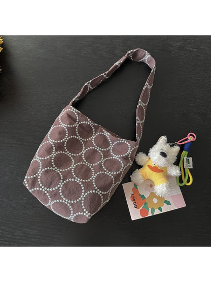 Model carrying Cosbai soft textured slouch tote bag over shoulder