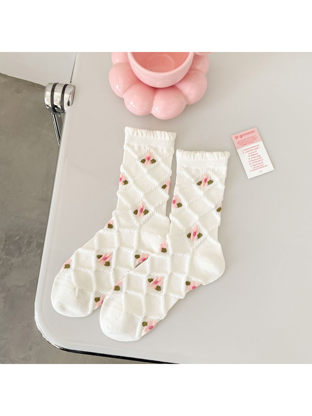 Rufia pink floral ribbed crew sock stretched to show elasticity and fabric detail