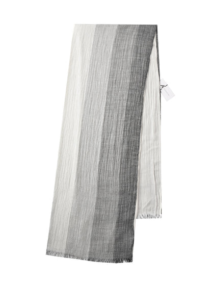 Scarvii Lightweight Farmhouse Scarf draped over a chair in a rustic farmhouse setting