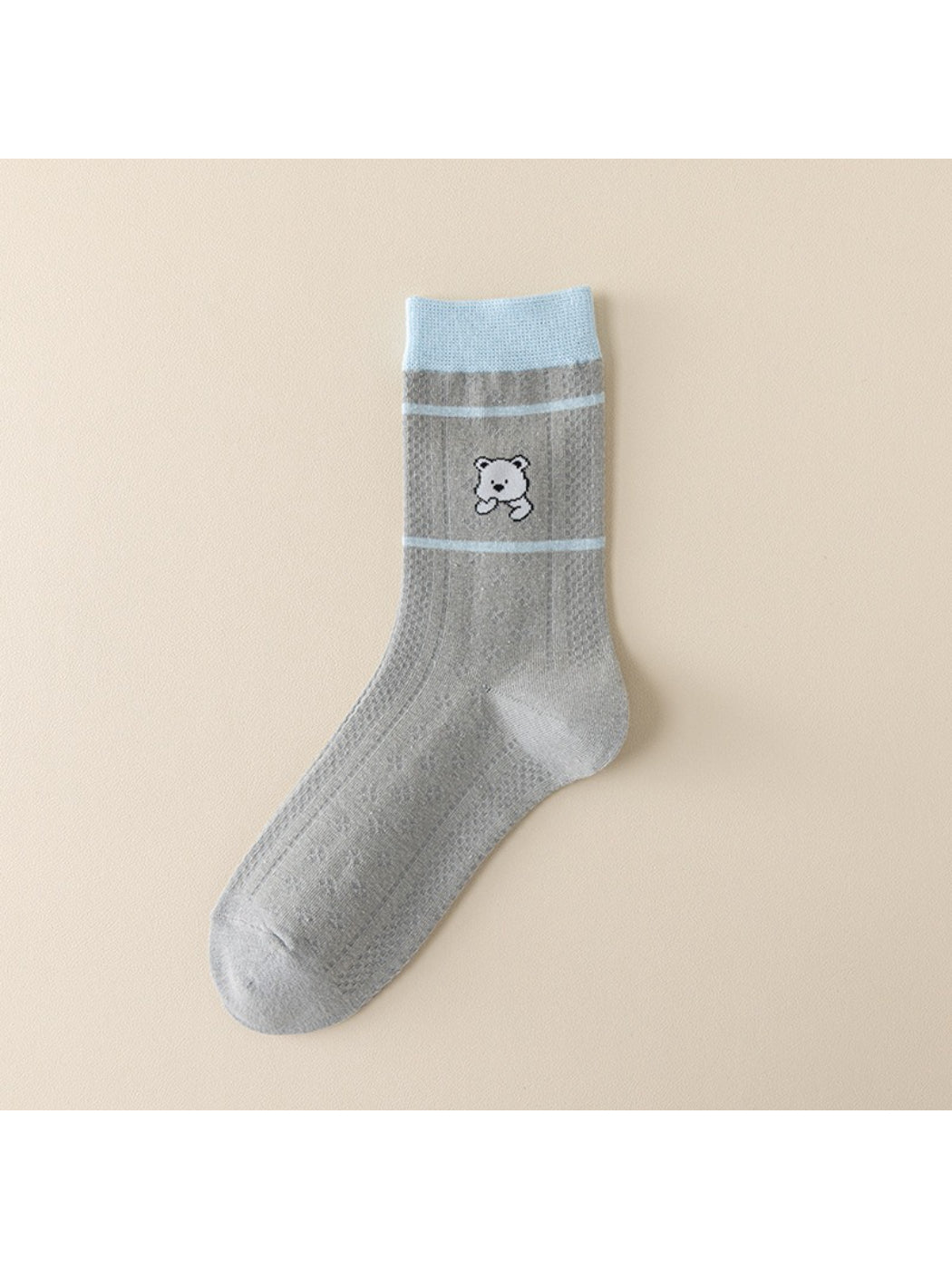 Rufia blue accent crew socks displayed with casual shoes