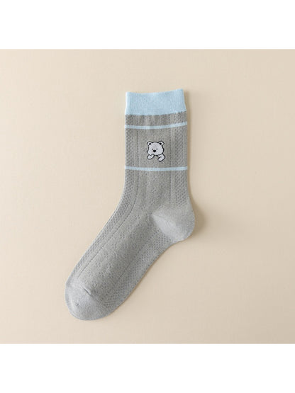 Rufia blue accent crew socks displayed with casual shoes